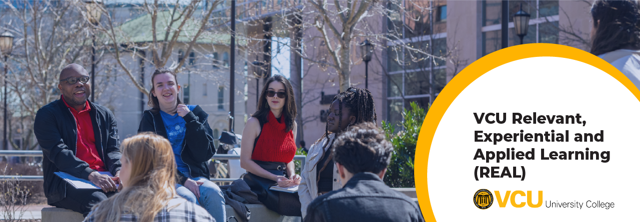 A group of students outside having a discussion with the text,