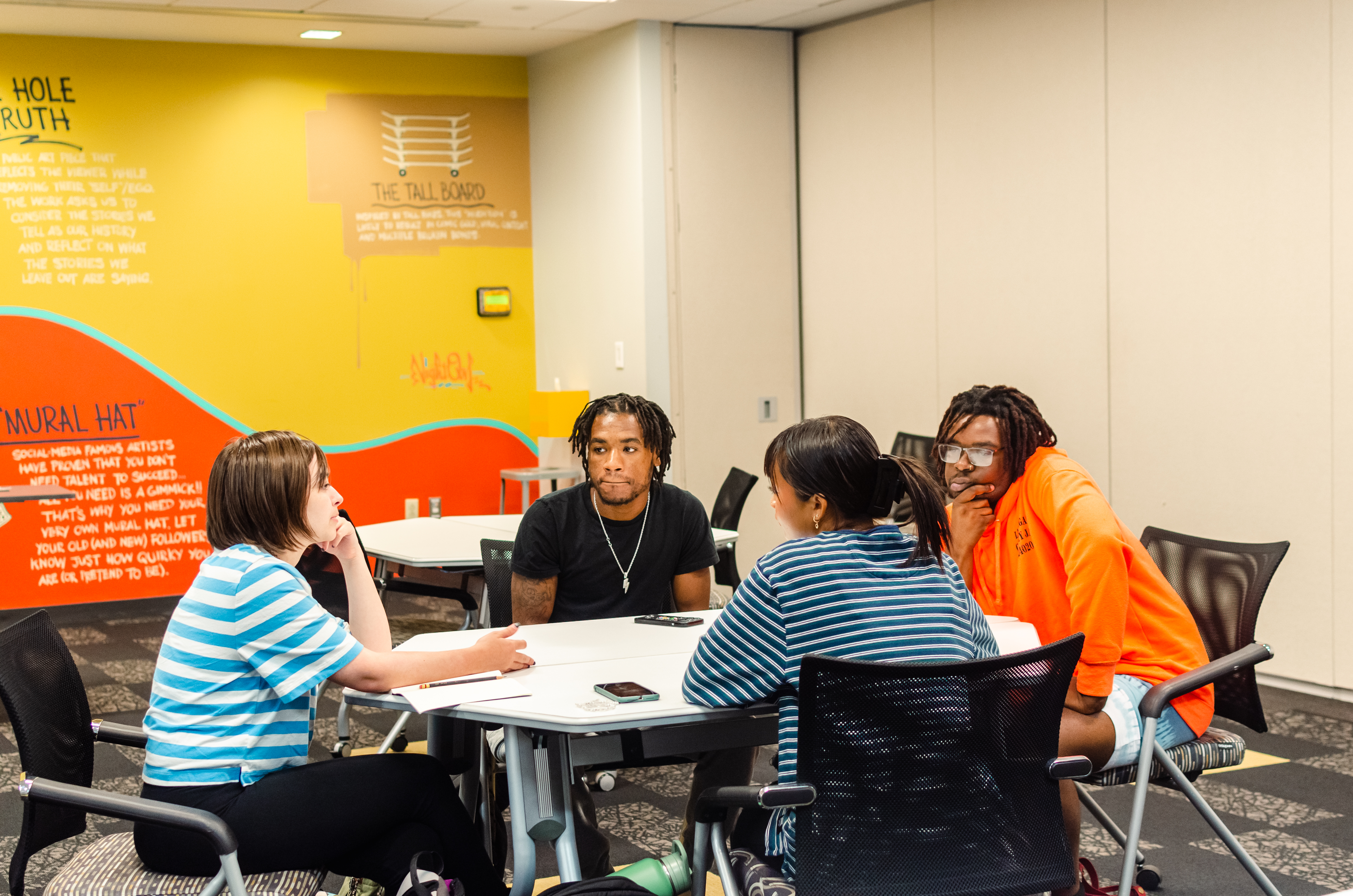 A group of students working at a round table